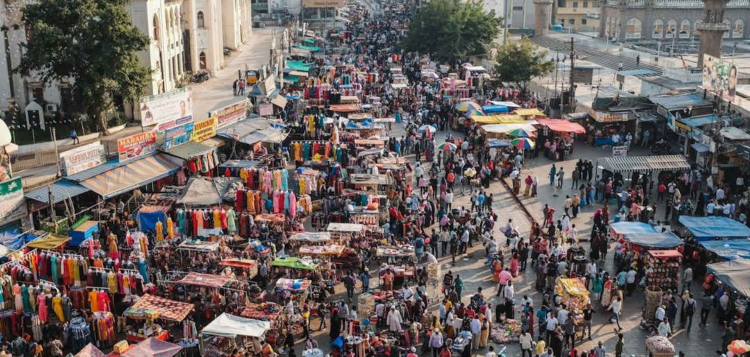 A busy street market in Malaysia with a variety of fresh produce and local delicacies